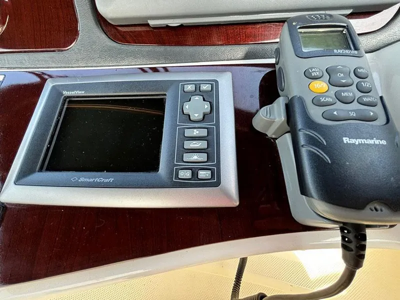 Slide: The Image of Control panel and Raymarine radio on 2011 Meridian 391 Sedan boat dashboard. - 38