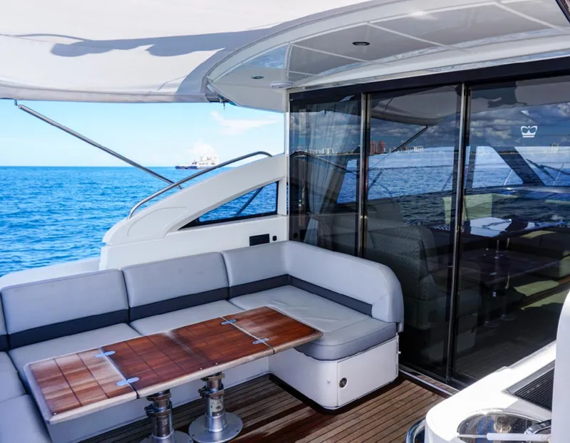 Slide: The Image of Luxurious 2015 Princess V52 yacht with elegant seating and ocean view. - 14