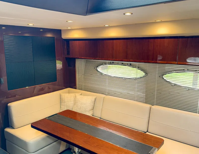 Slide: The Image of Luxurious interior of 2015 Princess V52 yacht with elegant seating and wooden table. - 16