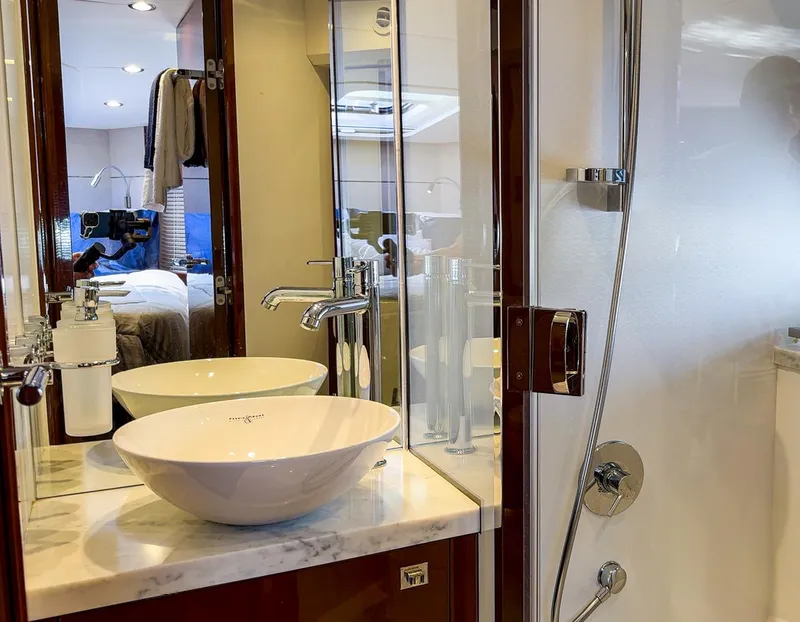 Slide: The Image of Luxurious bathroom in 2015 Princess V52 yacht with modern sink and shower. - 22