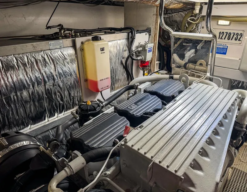 Slide: The Image of Engine room of 2015 Princess V52 yacht, showcasing detailed machinery and components. - 24