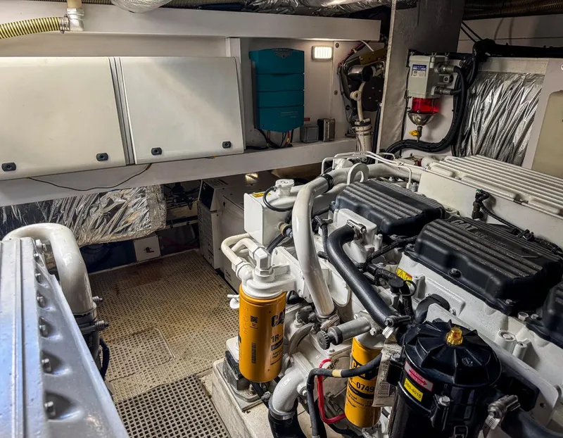 Slide: The Image of Engine room of 2015 Princess V52 yacht, showcasing mechanical components and systems. - 25