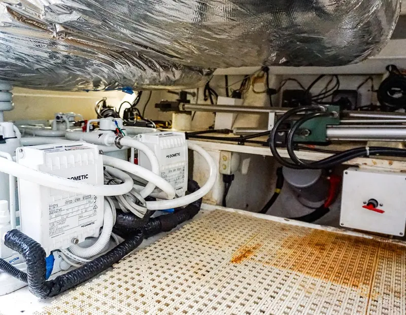 Slide: The Image of Engine room of 2015 Princess V52 yacht with mechanical equipment and wiring. - 26