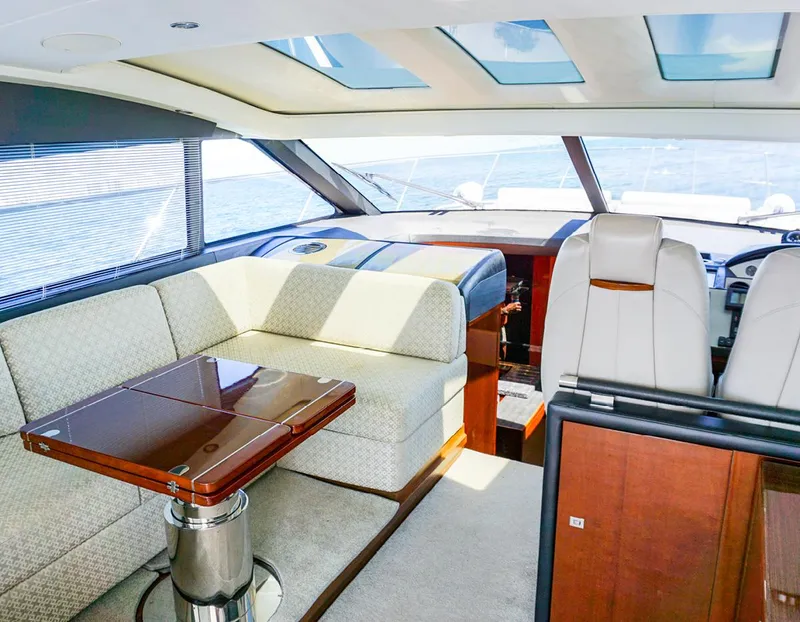 Slide: The Image of Luxurious interior of 2015 Princess V52 yacht with elegant seating and panoramic windows. - 6