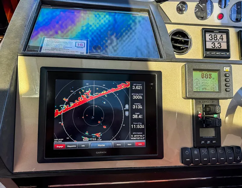 Slide: The Image of Control panel of 2015 Princess V52 yacht with navigation and radar display. - 9