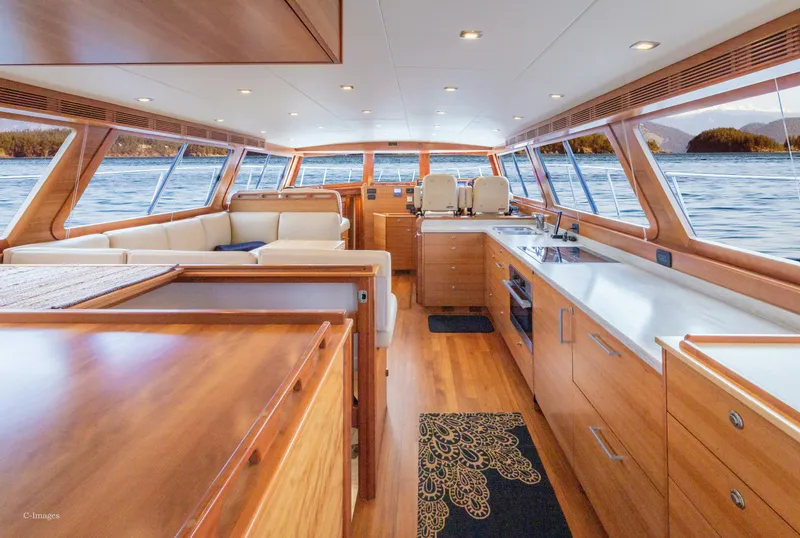 Slide: The Image of Luxurious interior of 2012 Coastal Craft 56 yacht with modern kitchen and seating area. - 12