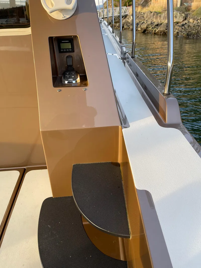 Slide: The Image of Staircase on 2012 Coastal Craft 56 yacht, featuring sleek metal and black steps. - 20