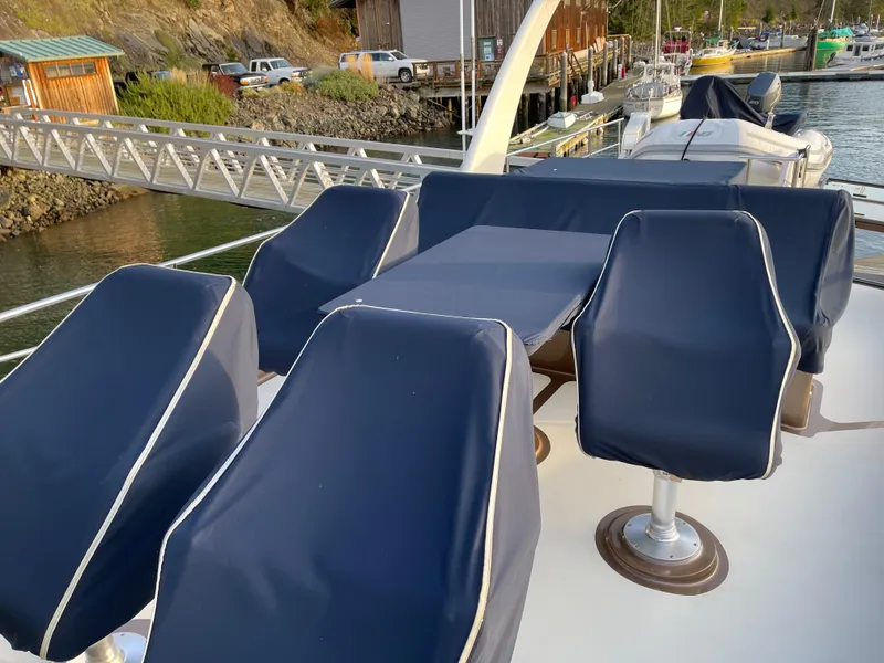 Slide: The Image of Helm of 2012 Coastal Craft 56 yacht with steering wheel and navigation controls. - 23