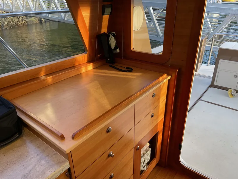 Slide: The Image of Luxurious 2012 Coastal Craft 56 yacht interior with wooden finish and decorative baskets. - 34