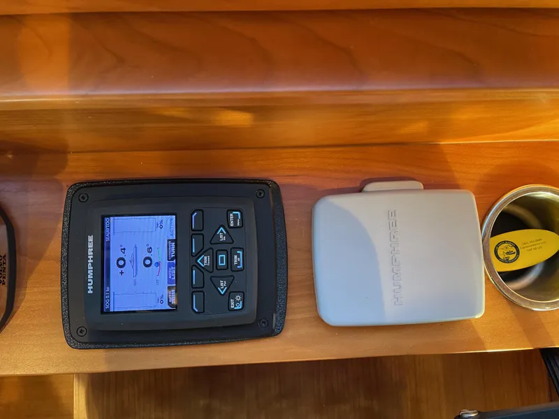 Slide: The Image of FLIR control panel on 2012 Coastal Craft 56 yacht, mounted on wooden surface. - 36