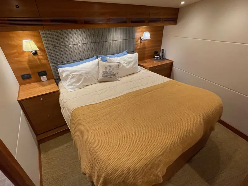 Slide: The Image of Luxurious cabin interior of 2012 Coastal Craft 56 yacht with wood paneling and TV. - 38