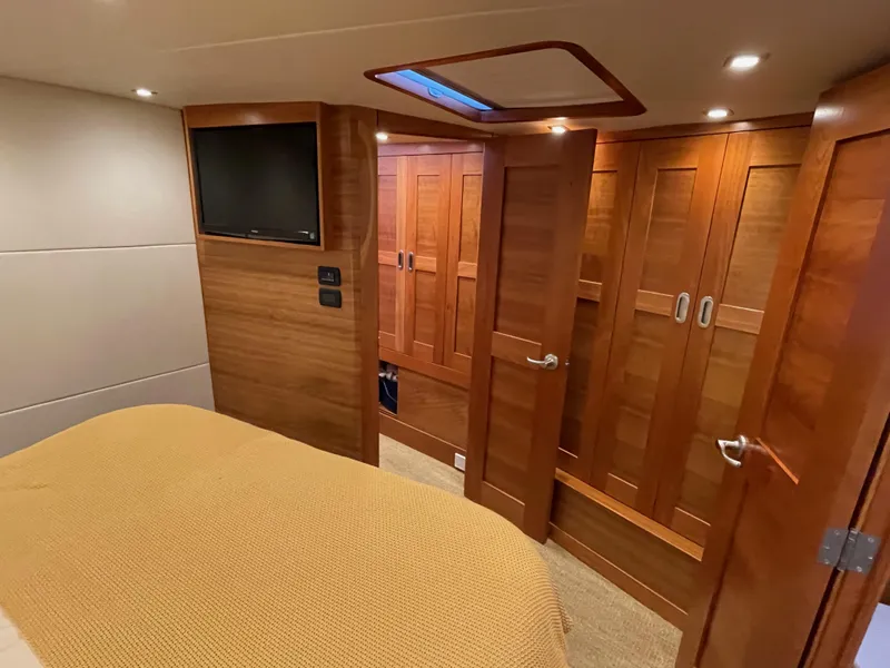 Slide: The Image of Luxurious cabin interior of 2012 Coastal Craft 56 yacht with wood finishes and TV. - 39