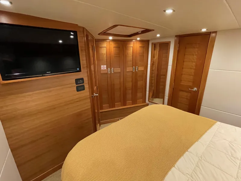 Slide: The Image of Cozy cabin bed in 2012 Coastal Craft 56 yacht, featuring wooden interior and soft lighting. - 40
