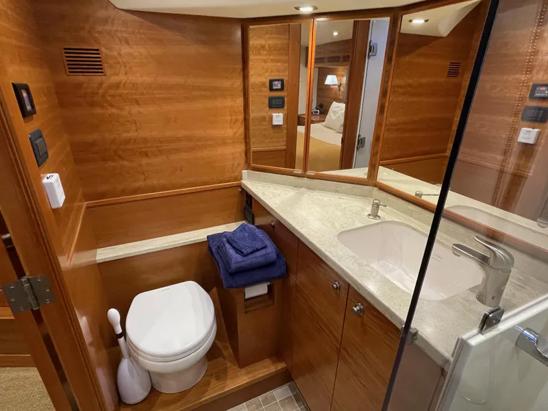 Slide: The Image of Luxurious bathroom in 2012 Coastal Craft 56 yacht with wood accents and modern fixtures. - 42