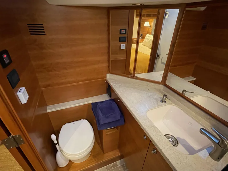 Slide: The Image of Luxurious bathroom in 2012 Coastal Craft 56 yacht with wooden cabinetry and modern fixtures. - 43