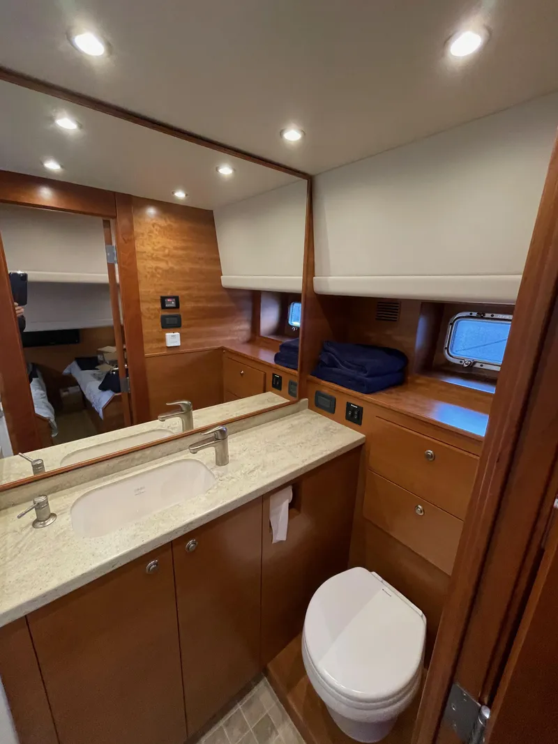 Slide: The Image of Shower area in 2012 Coastal Craft 56 yacht with modern fixtures and tiled floor. - 47