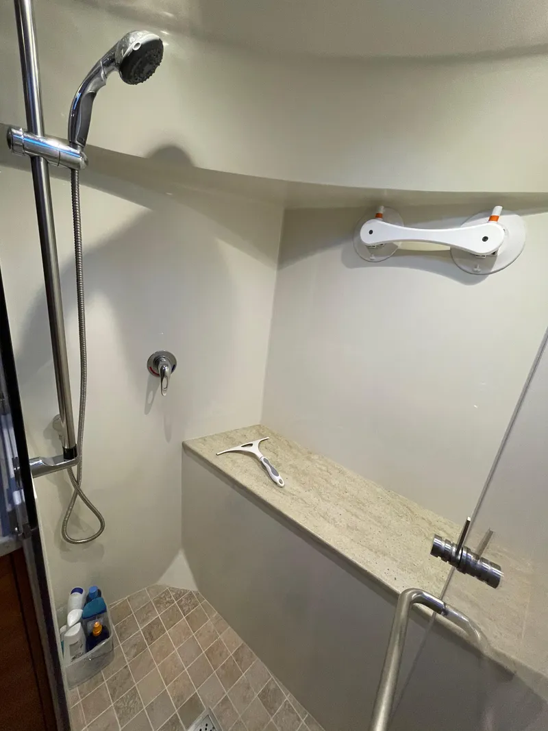 Slide: The Image of Luxurious shower in 2012 Coastal Craft 56 yacht with glass door and modern fixtures. - 48