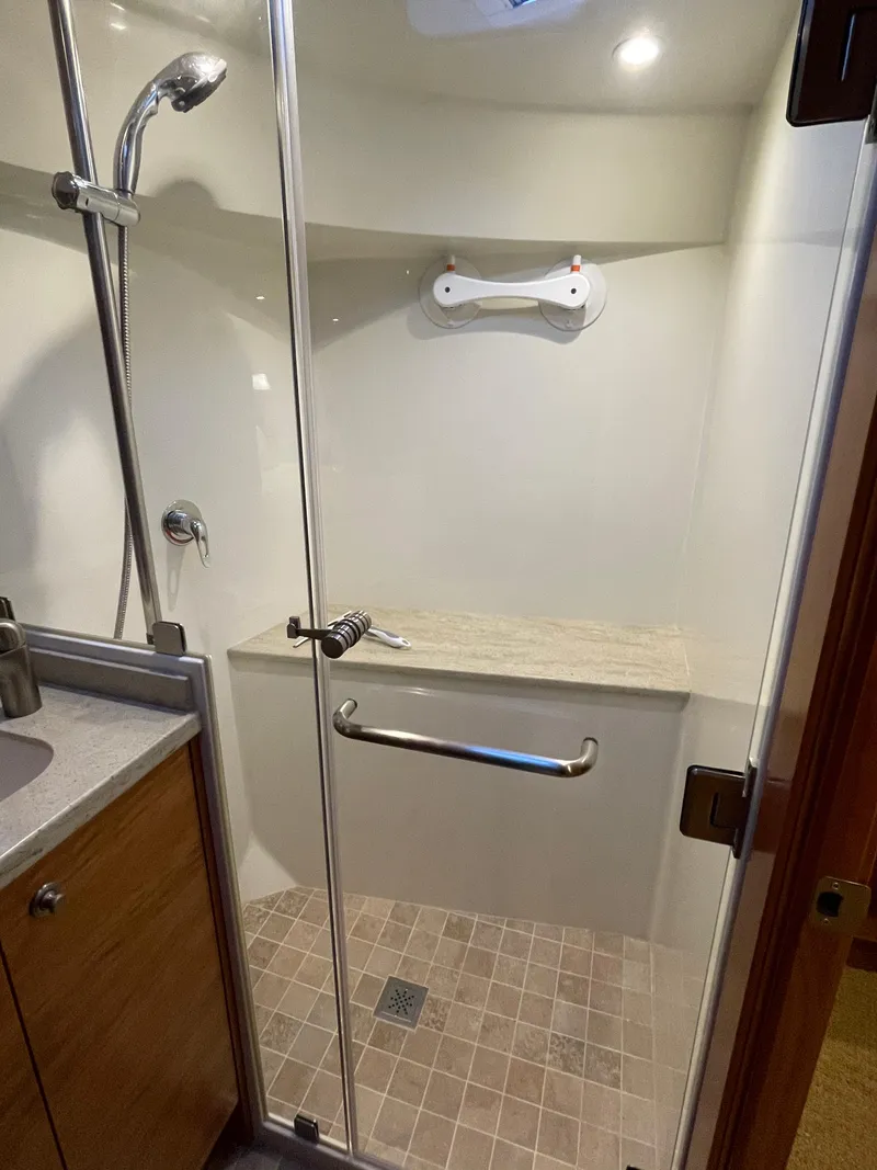 Slide: The Image of Shower area in 2012 Coastal Craft 56 yacht with modern fixtures and window. - 49