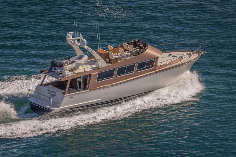 Slide: The Image of Luxurious 2012 Coastal Craft 56 yacht cruising on open water. - 7