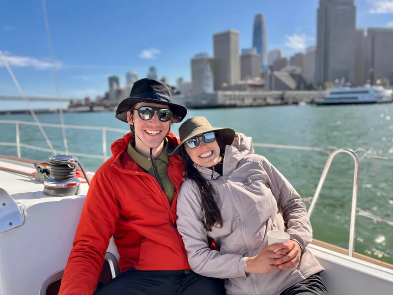 Slide: The Image of Couple enjoying a sail on a 2013 Beneteau 37 with city skyline backdrop. - 19