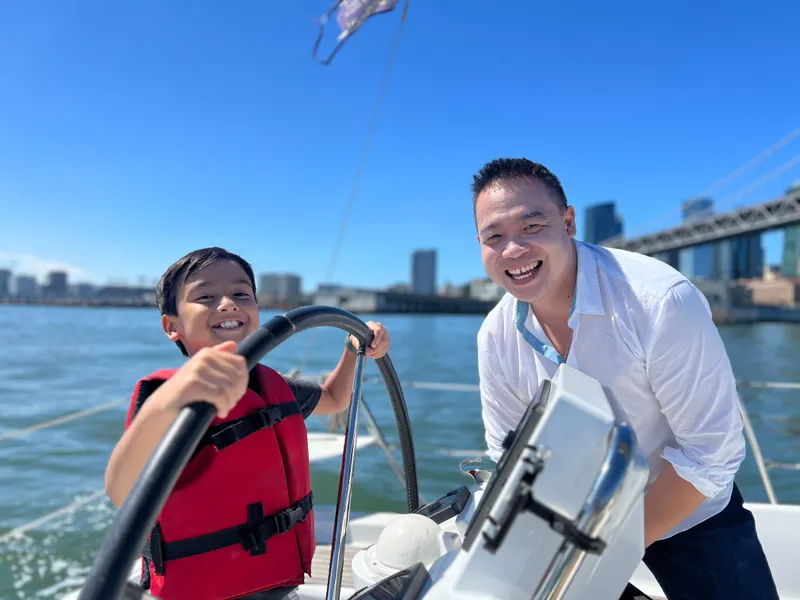 Slide: The Image of Father and child enjoying sailing on a 2013 Beneteau 37 yacht. - 20
