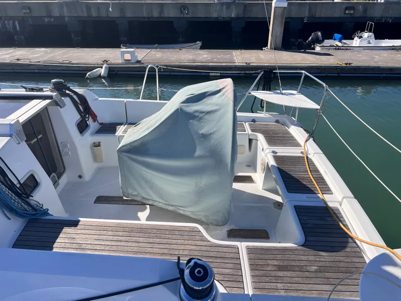 Slide: The Image of Beneteau 37 sailboat cockpit, 2013 model, docked at marina with covered helm. - 21