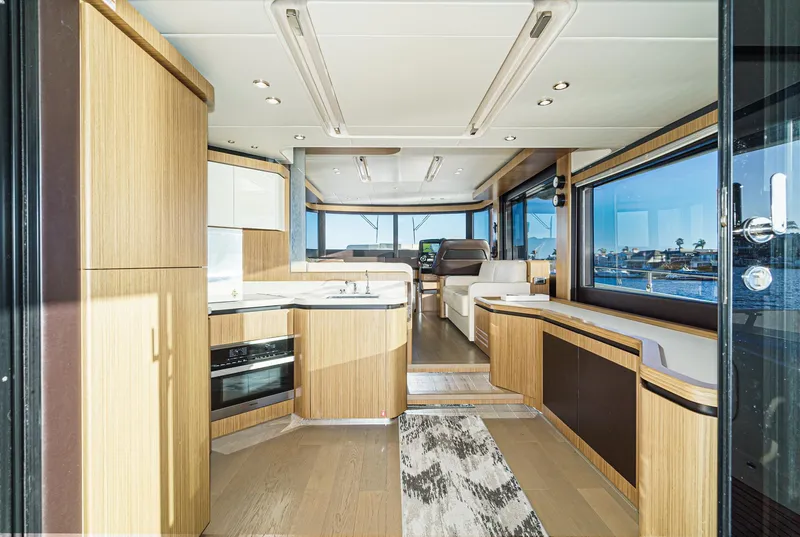 Slide: The Image of Luxurious interior of 2017 Absolute NAVETTA yacht with modern kitchen and panoramic windows. - 11