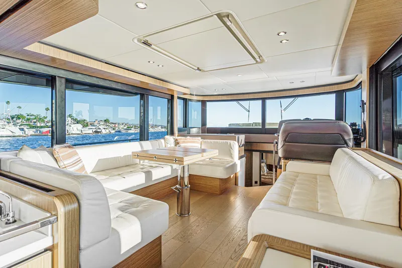 Slide: The Image of Luxurious interior of 2017 Absolute NAVETTA yacht with panoramic windows and elegant seating. - 15