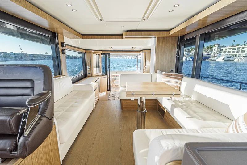 Slide: The Image of Luxurious interior of 2017 Absolute NAVETTA yacht with panoramic windows and elegant seating. - 17