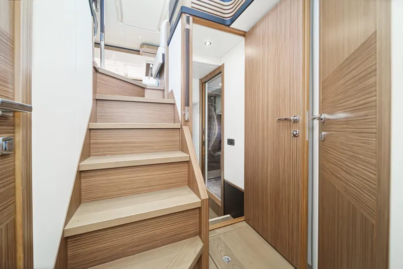 Slide: The Image of Interior of 2017 Absolute NAVETTA yacht with wooden stairs and modern design. - 22