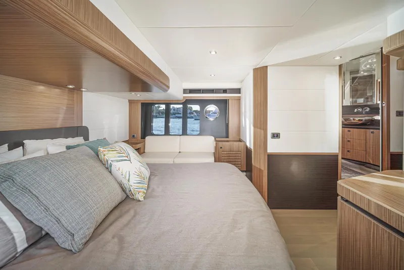 Slide: The Image of Luxurious 2017 Absolute NAVETTA yacht bedroom with modern wood accents and ocean view. - 24