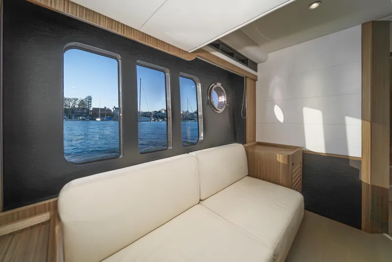 Slide: The Image of Interior of 2017 Absolute NAVETTA yacht with scenic water view through windows. - 26