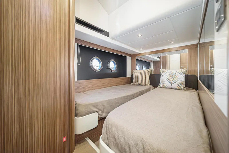 Slide: The Image of Luxurious 2017 Absolute NAVETTA yacht cabin with twin beds and stylish decor. - 28