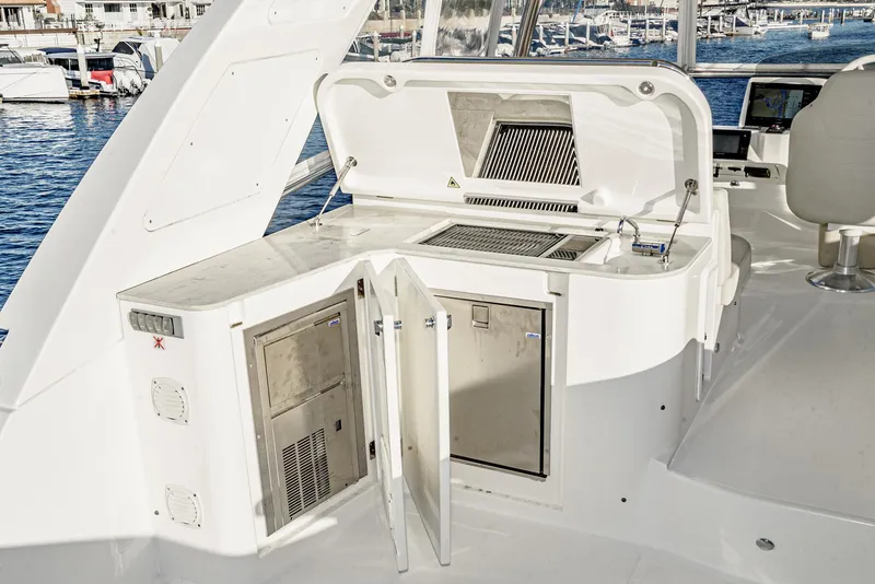 Slide: The Image of Outdoor kitchen on 2017 Absolute NAVETTA yacht with grill and sink, docked at marina. - 32