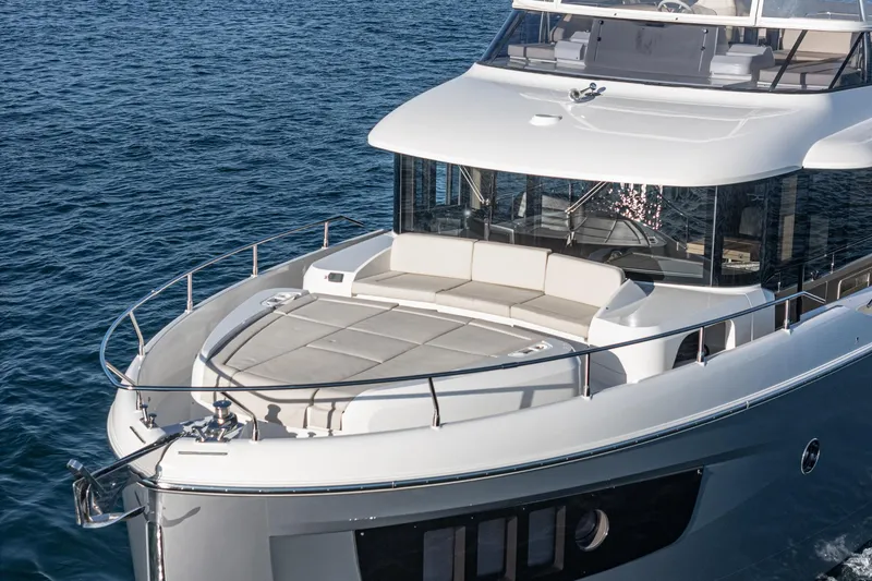 Slide: The Image of Luxury 2017 Absolute NAVETTA yacht on open sea, featuring spacious deck and modern design. - 4