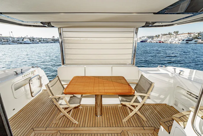 Slide: The Image of Luxury yacht Absolute NAVETTA 2017, featuring a teak deck and waterfront view. - 40