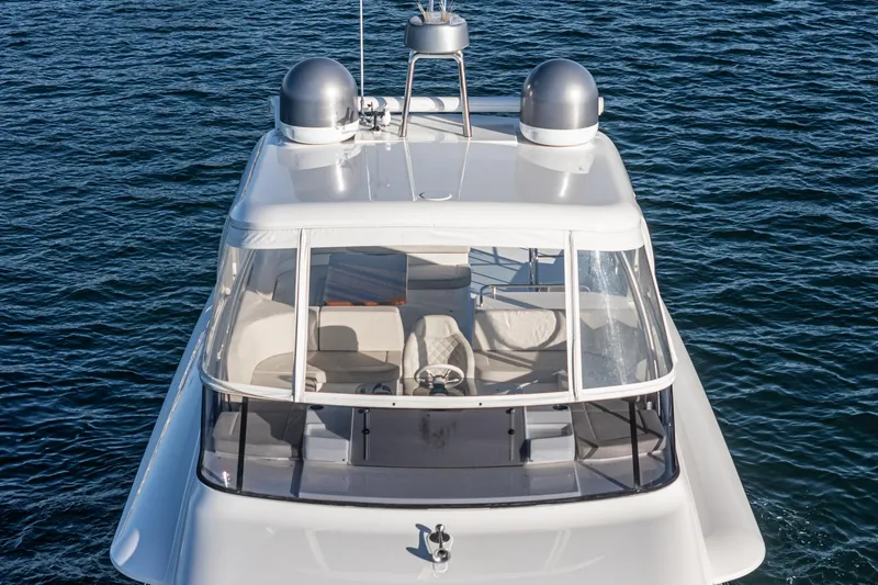 Slide: The Image of 2017 Absolute NAVETTA yacht on calm blue water, top view. - 49