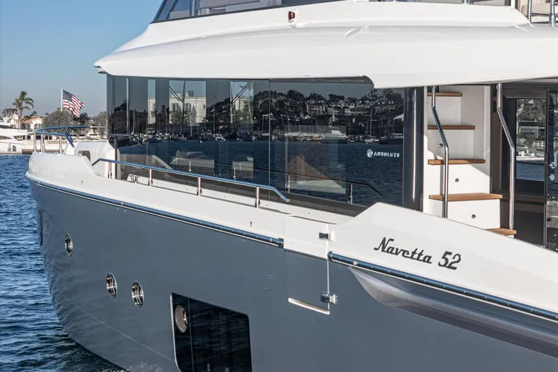 Slide: The Image of 2017 Absolute Navetta 52 yacht on water, showcasing sleek design and luxury features. - 51