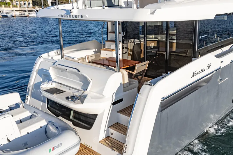Slide: The Image of Luxury Absolute NAVETTA 2017 yacht with elegant deck and seating area on the water. - 72