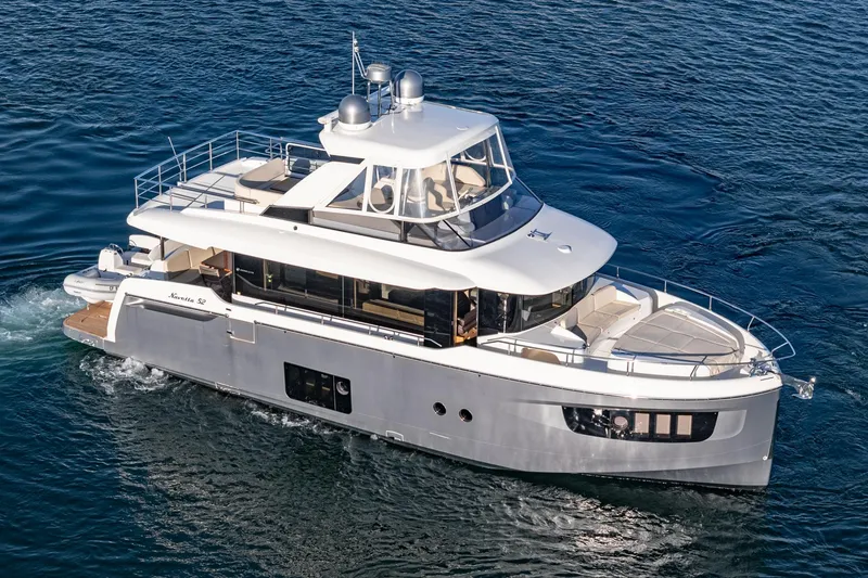 Slide: The Image of Luxury 2017 Absolute NAVETTA yacht cruising on open water. - 73