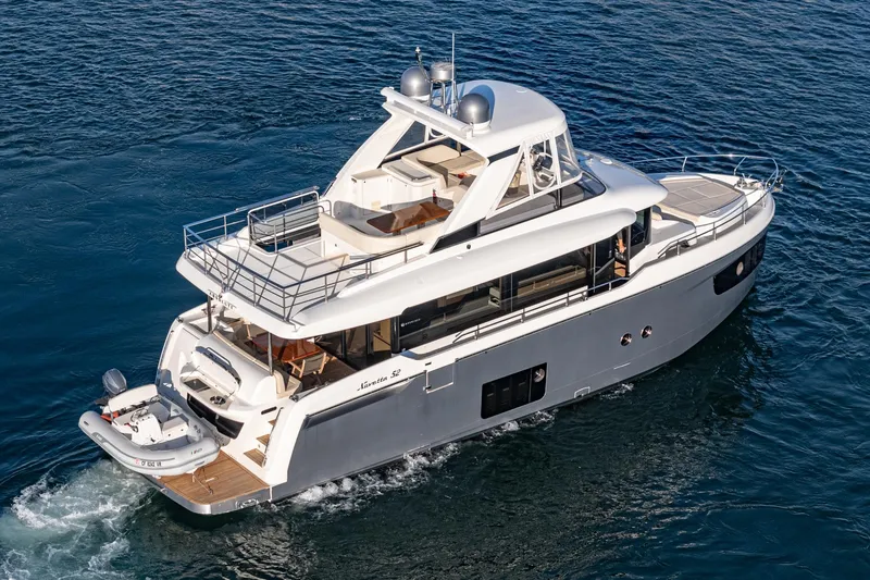 Slide: The Image of Luxury 2017 Absolute NAVETTA yacht cruising on open water. - 74