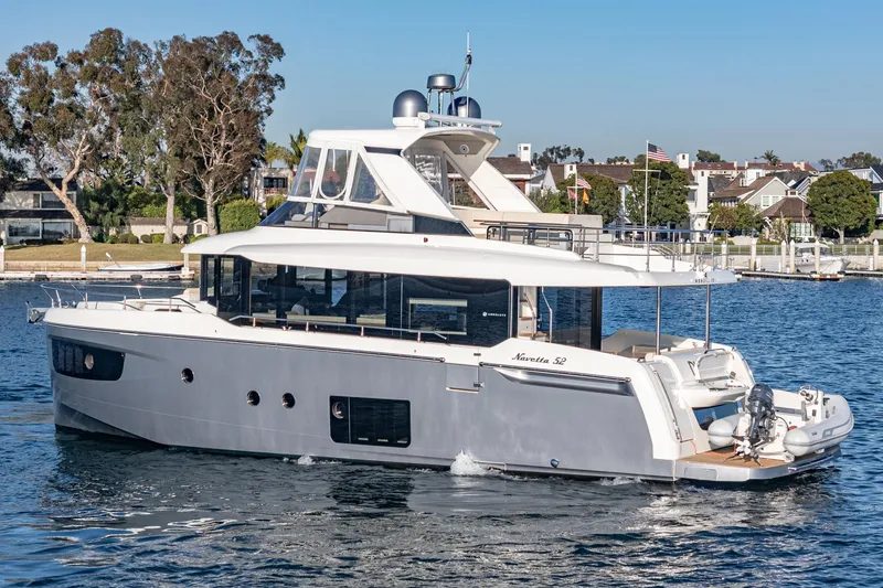 Slide: The Image of Luxury 2017 Absolute NAVETTA yacht cruising in a scenic marina. - 75