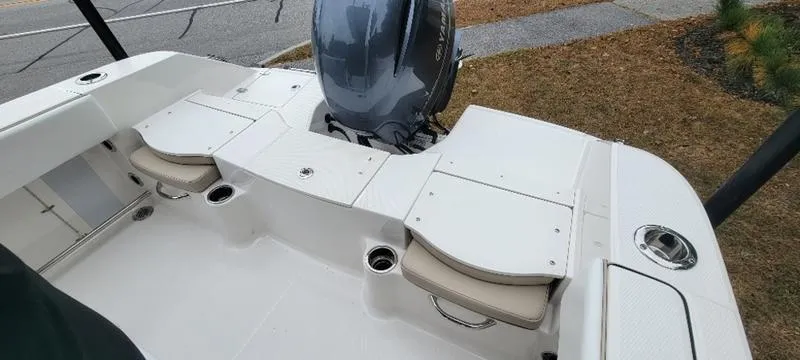 Slide: The Image of 2021 Robalo R200 boat interior with seating and motor, showcasing sleek design and functionality. - 11