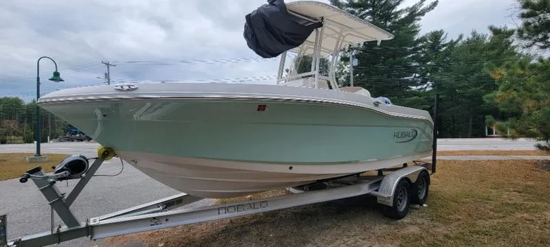 Slide: The Image of 2021 Robalo R200 boat on trailer, parked outdoors, overcast sky. - 14