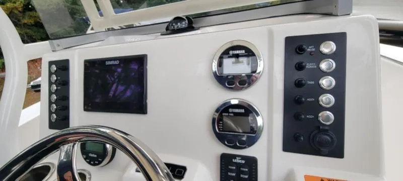 Slide: The Image of Dashboard of 2021 Robalo R200 boat with navigation and control instruments. - 20