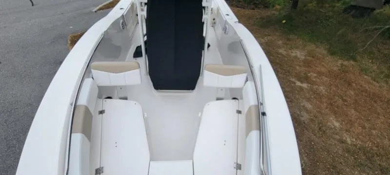 Slide: The Image of 2021 Robalo R200 boat interior with white seating and black console. - 6