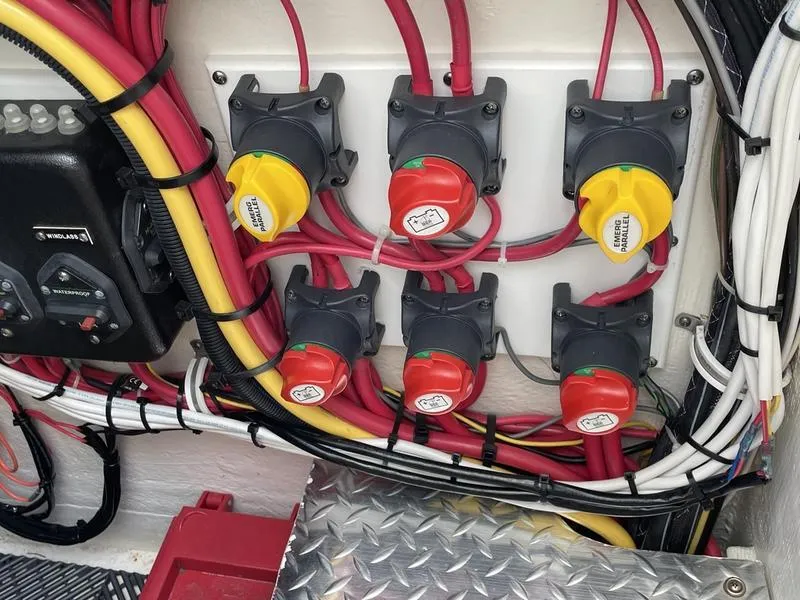 Slide: The Image of Electrical panel with switches and wiring on a 2016 Jarrett Bay 32 Walk Around boat. - 10