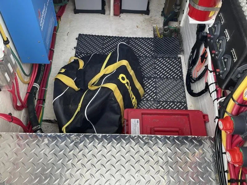 Slide: The Image of Engine room of 2016 Jarrett Bay 32 Walk Around with equipment and storage bag. - 12