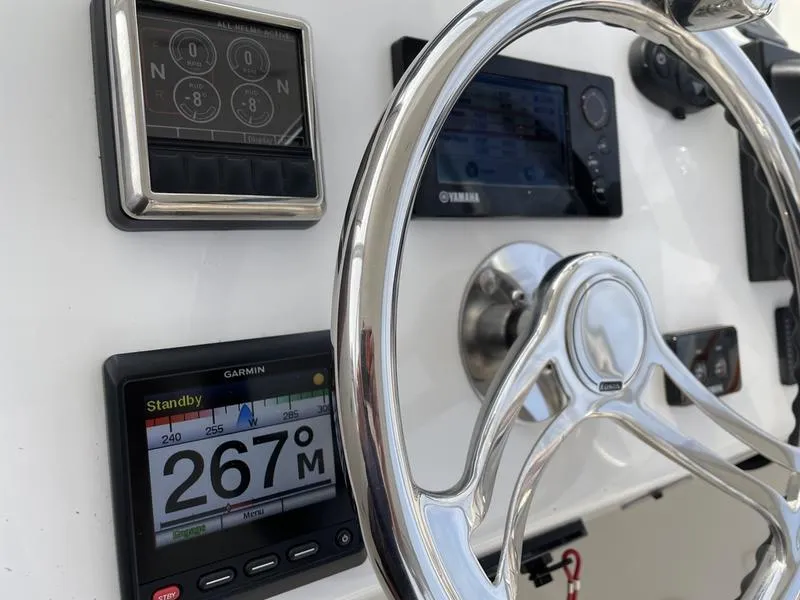 Slide: The Image of Close-up of 2016 Jarrett Bay 32 WALK AROUND helm with Garmin and Yamaha displays. - 17