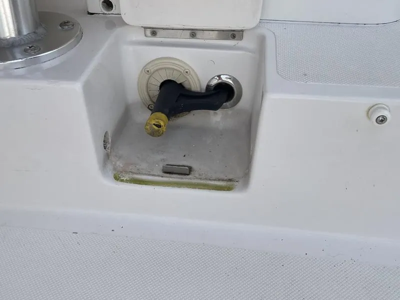 Slide: The Image of 2016 Jarrett Bay 32 Walk Around boat deck detail with hose connection. - 20